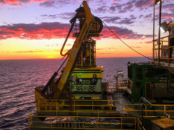 TMT's ROV at sea during sunset
